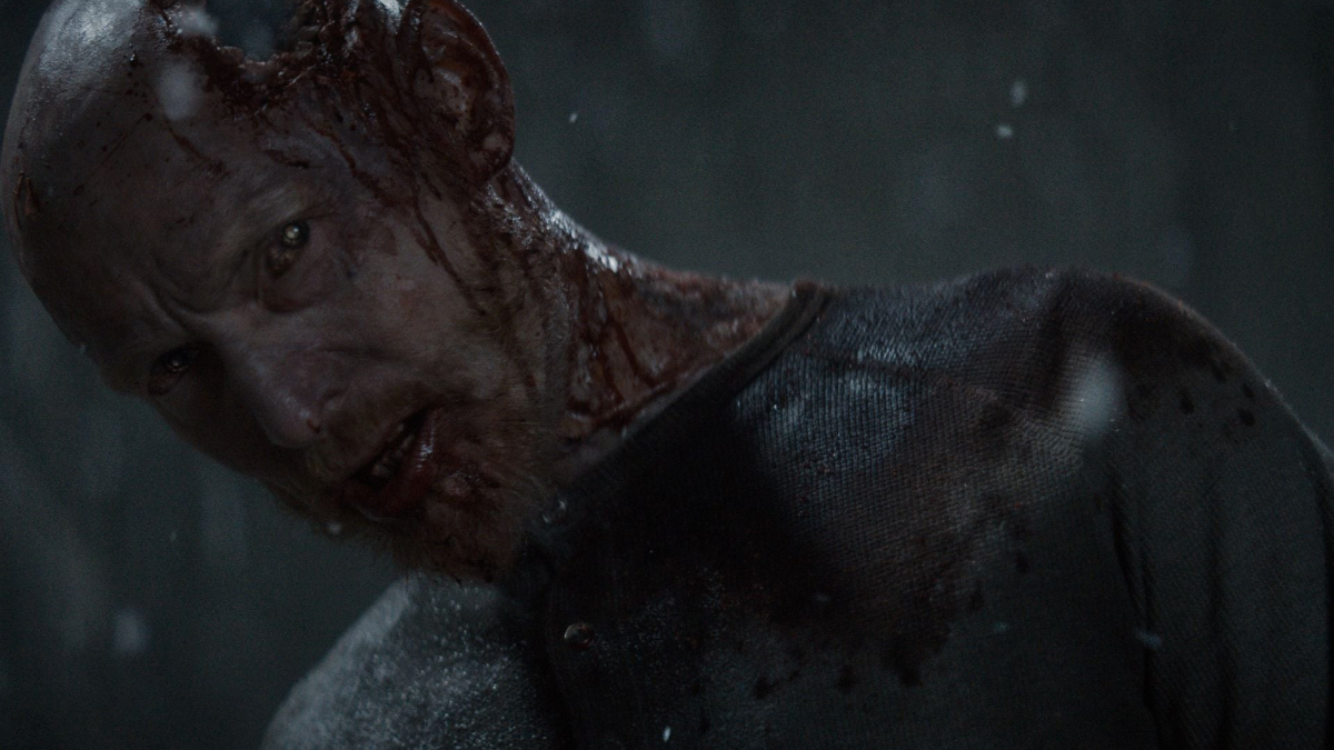 Promotional still of Deadite Edgar in Evil Dead Burn.